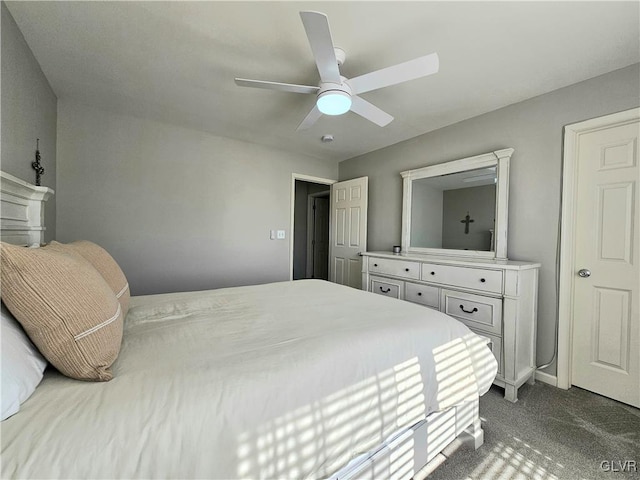 bedroom with carpet, ceiling fan, and baseboards