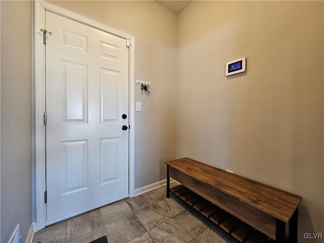 interior space featuring baseboards