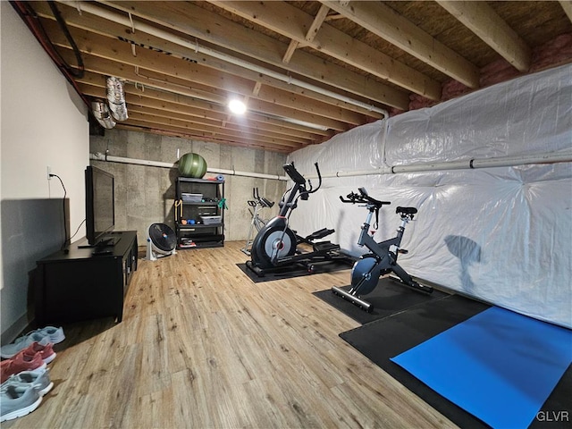 exercise area with wood finished floors