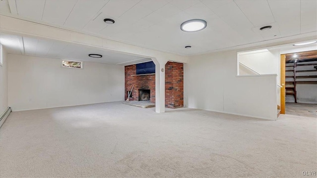 unfurnished living room with carpet flooring and a fireplace