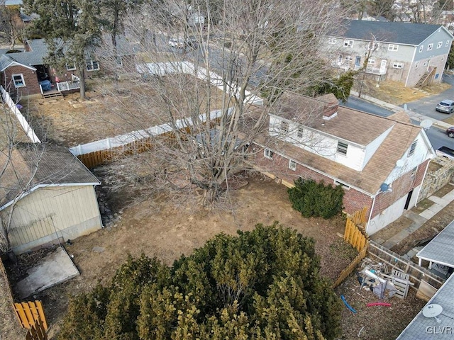 birds eye view of property with a residential view