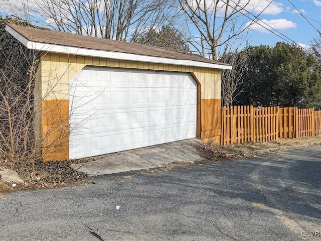 detached garage with fence