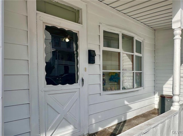 view of exterior entry featuring a porch