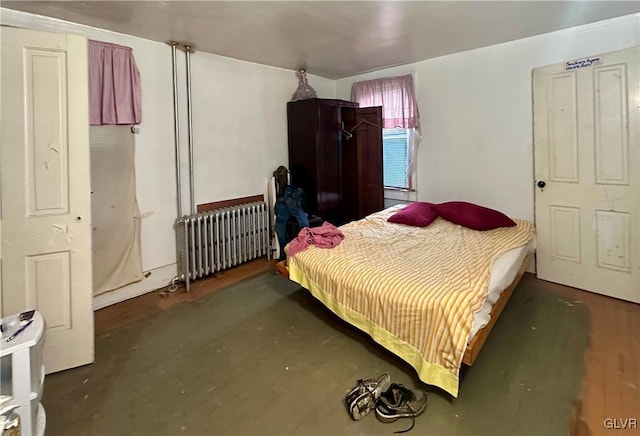 bedroom featuring radiator heating unit