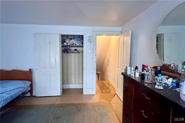 bedroom with a closet and light wood-type flooring