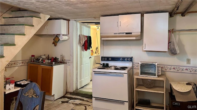 kitchen featuring white cabinetry, white electric stove, and under cabinet range hood