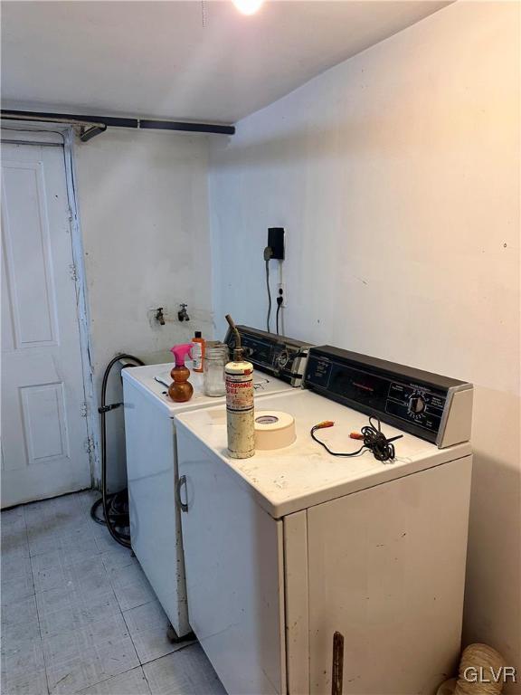 kitchen with washing machine and dryer and light countertops