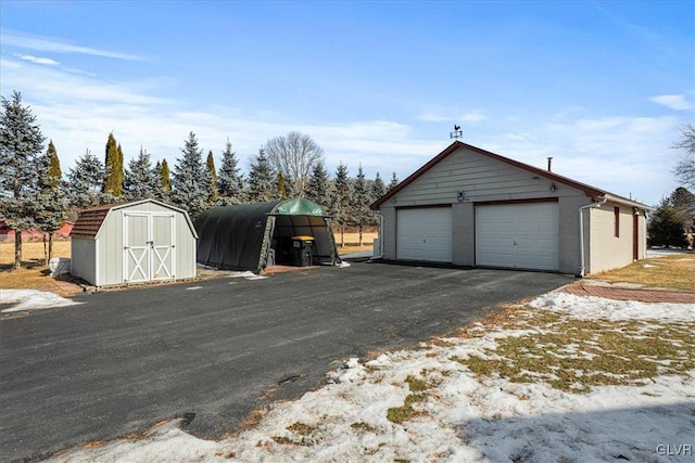 detached garage with a shed