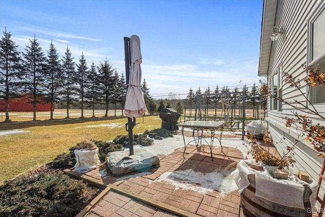 view of patio featuring fence