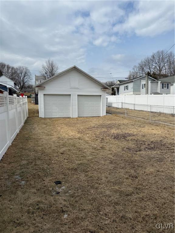 detached garage with fence