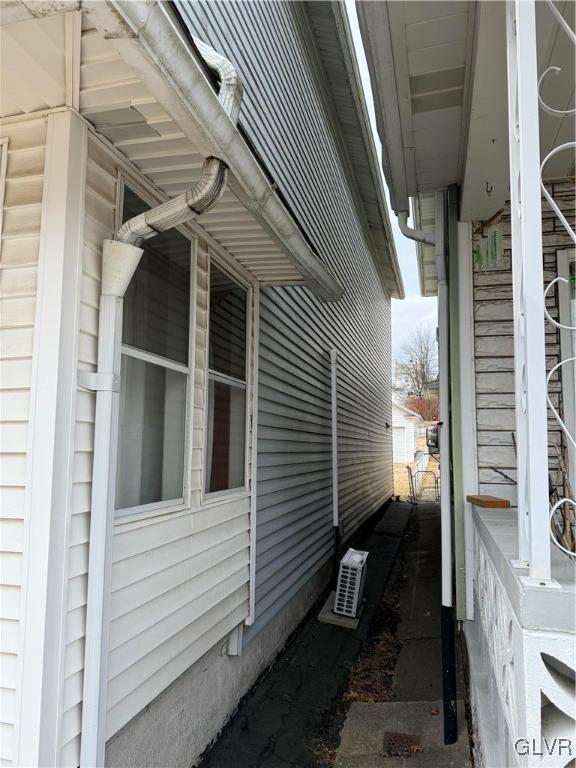 view of side of property featuring ac unit