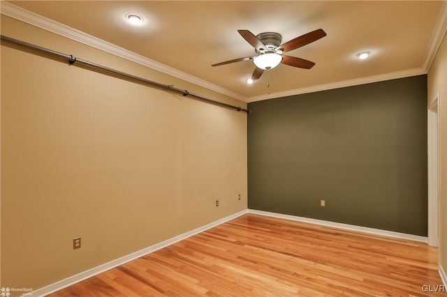 unfurnished room with crown molding, light wood-style flooring, baseboards, and ceiling fan