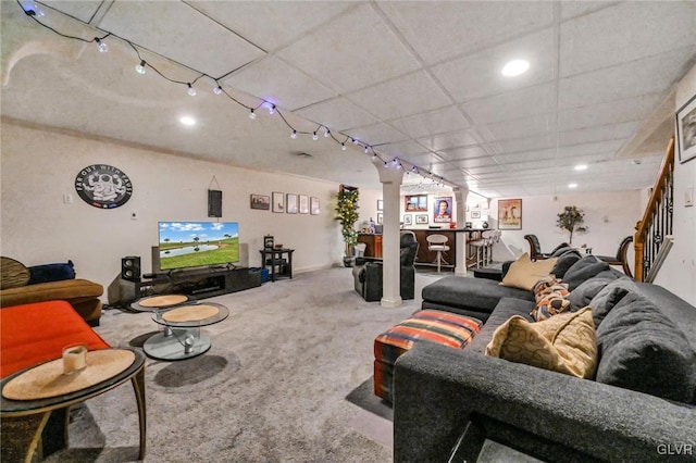 carpeted living room with a paneled ceiling and recessed lighting