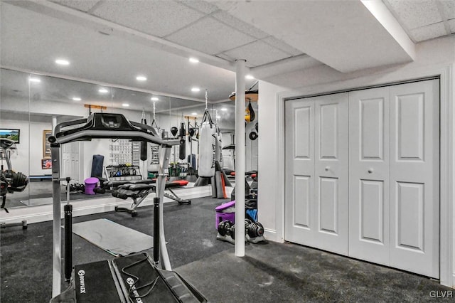 exercise room with a paneled ceiling