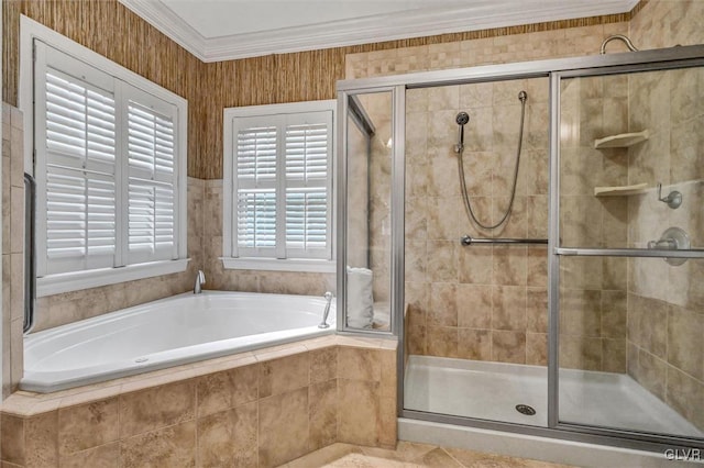 bathroom featuring a stall shower, a garden tub, and crown molding