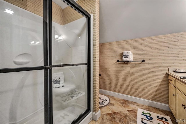 full bath with a shower stall and vanity