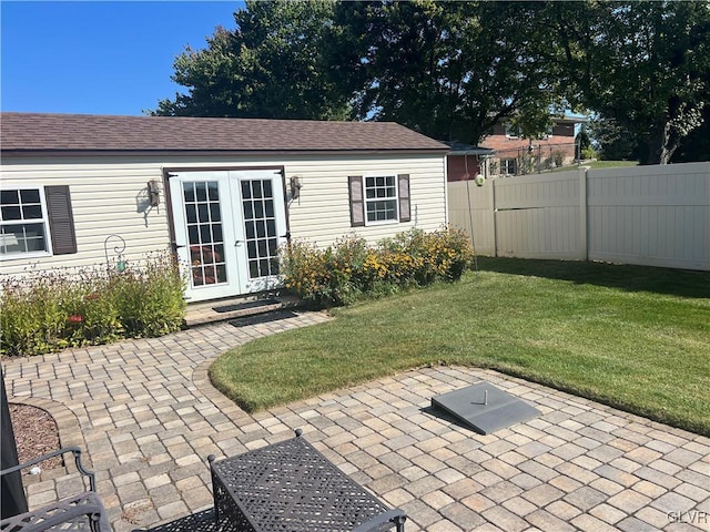 exterior space with french doors and fence