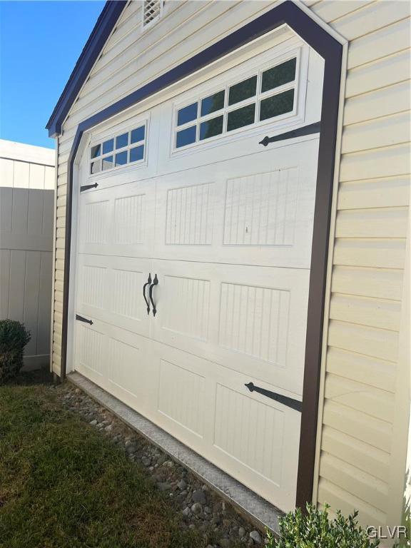 garage with fence