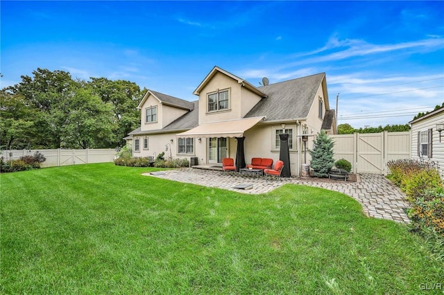 back of property featuring stucco siding, a fenced backyard, a yard, and a patio