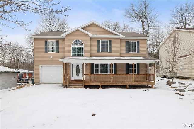 view of front of property featuring an attached garage and a porch