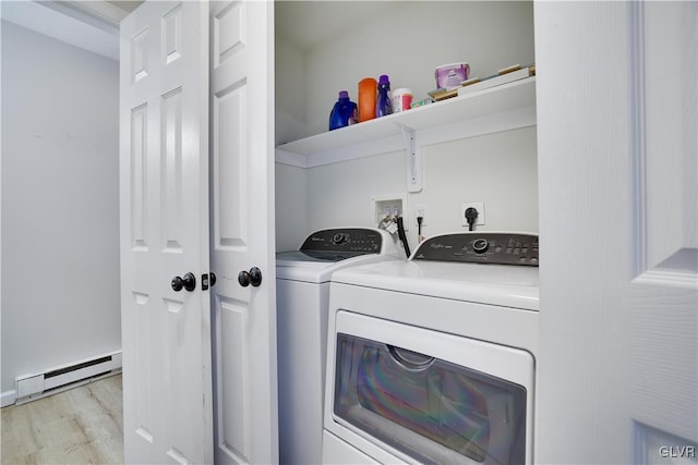 washroom featuring light wood-style floors, independent washer and dryer, and baseboard heating