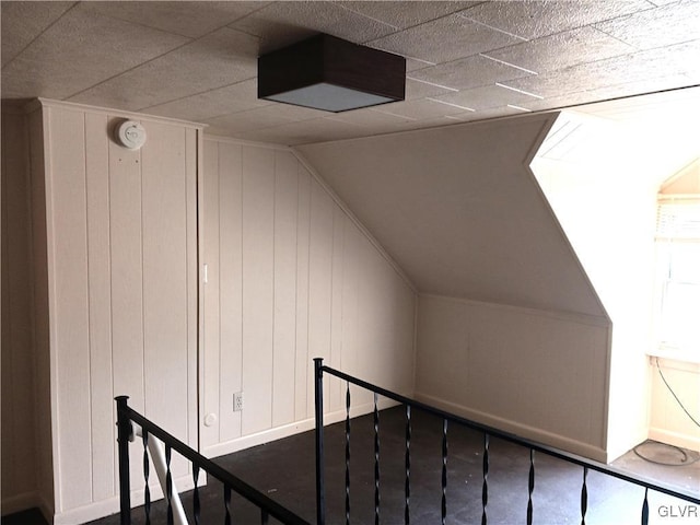 stairway featuring lofted ceiling