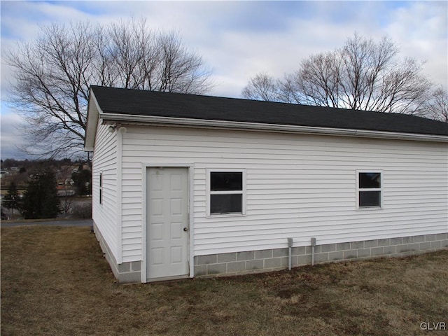 view of side of property with a yard