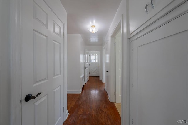 corridor featuring wood finished floors