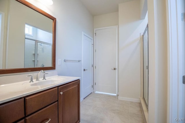 bathroom with a stall shower and vanity