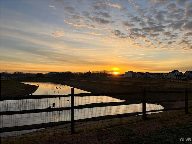 water view featuring fence