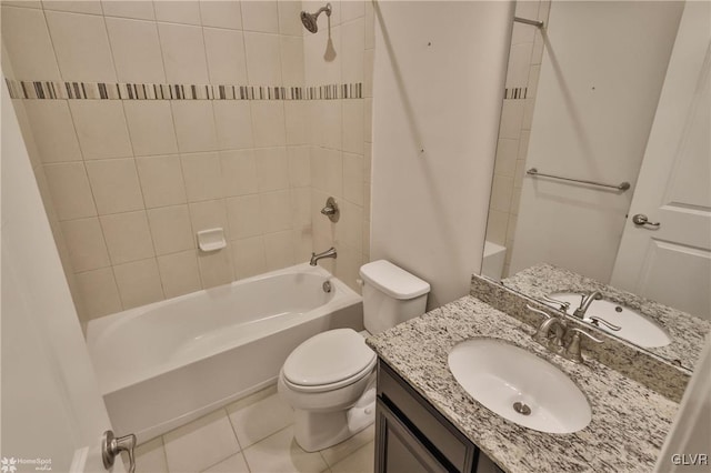 bathroom featuring toilet, tile patterned flooring, washtub / shower combination, and vanity