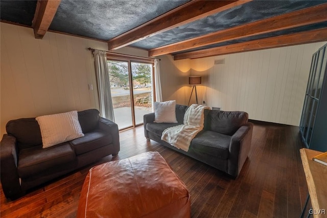 living room with hardwood / wood-style floors and beam ceiling