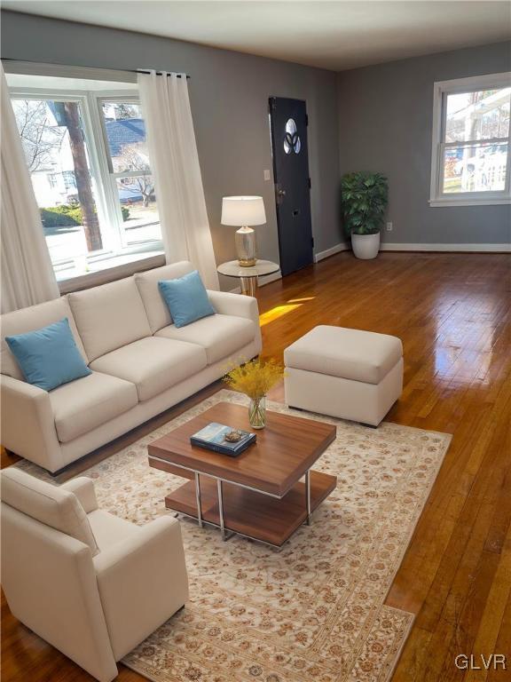 living room with wood-type flooring and baseboards