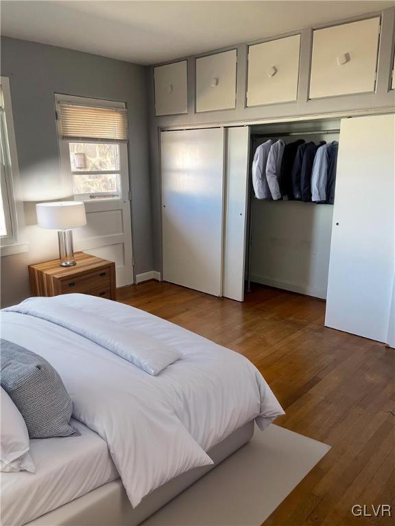 bedroom featuring a closet and wood finished floors