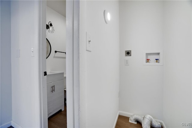 laundry area featuring laundry area, dark wood-type flooring, hookup for a washing machine, and hookup for an electric dryer