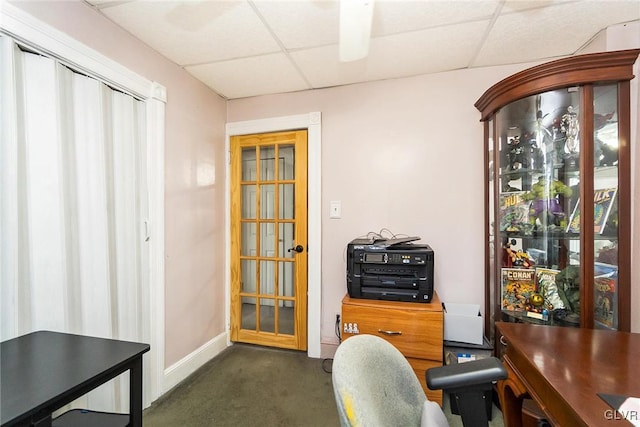 office with a paneled ceiling and baseboards