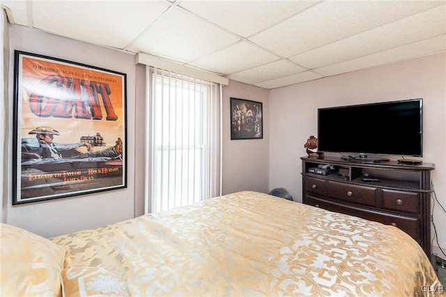 bedroom with a paneled ceiling