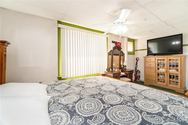 interior space featuring a drop ceiling and ceiling fan