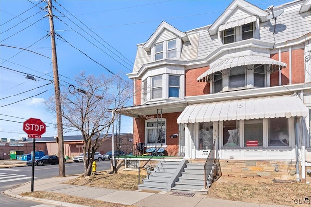 view of property with brick siding