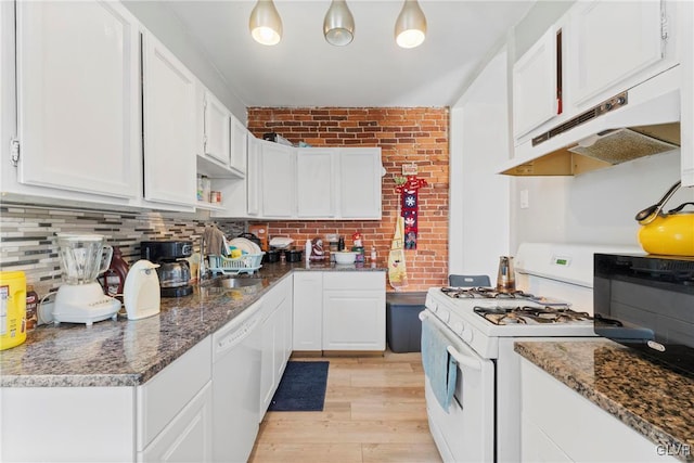 kitchen with white appliances, light wood-type flooring, under cabinet range hood, white cabinetry, and a sink