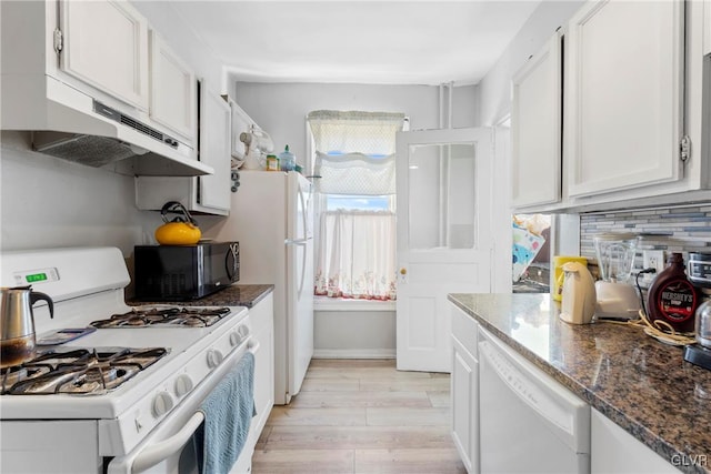 kitchen featuring light wood finished floors, backsplash, white cabinets, white appliances, and under cabinet range hood