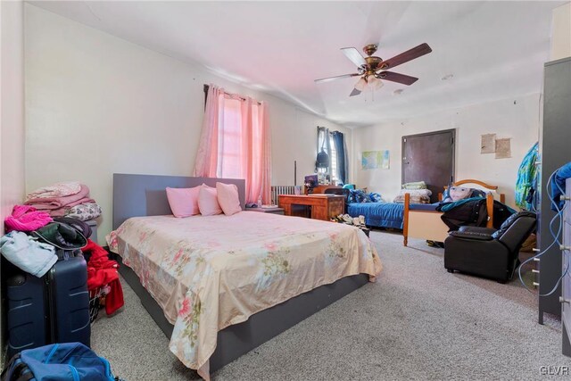 bedroom featuring carpet and a ceiling fan