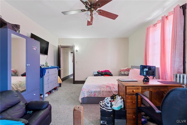 bedroom with ceiling fan and carpet flooring