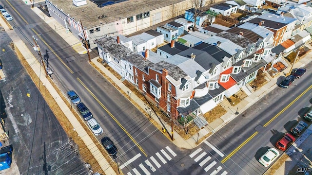 birds eye view of property with a residential view