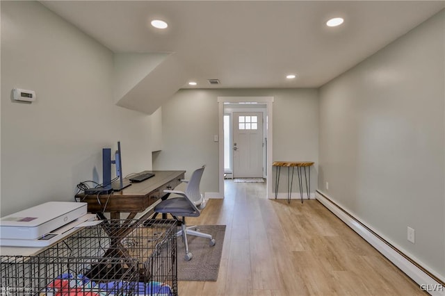 office with light wood-style flooring, recessed lighting, visible vents, baseboards, and baseboard heating