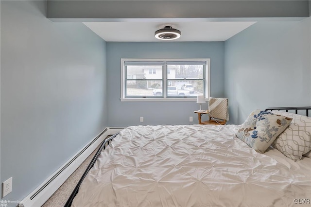 bedroom with a baseboard heating unit