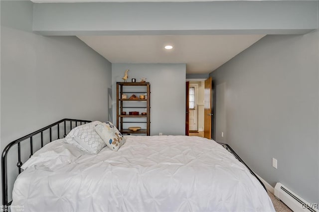 bedroom with baseboard heating and recessed lighting