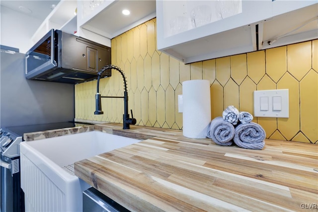 interior space featuring wooden counters and a sink