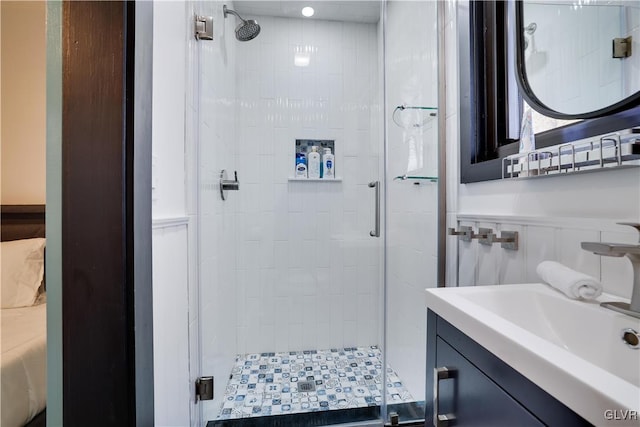 full bath featuring a stall shower and vanity