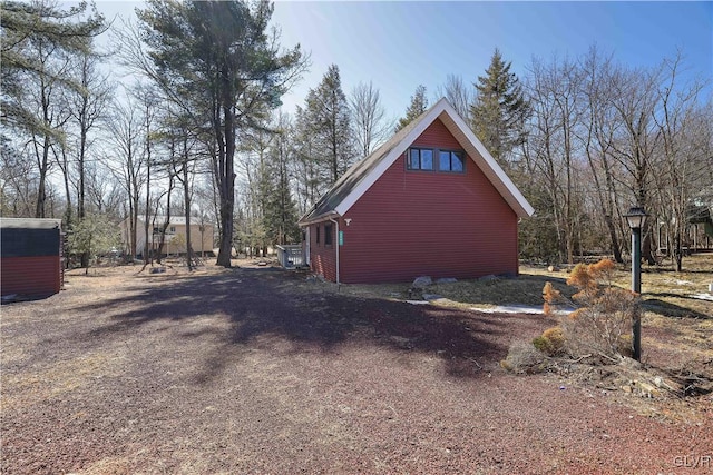 view of property exterior with driveway